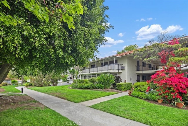 2319 Via Puerta Unit O, Laguna Woods, CA 92637 - view of property's community featuring a lawn