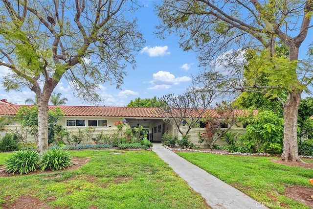 2319 Via Puerta Unit O, Laguna Woods, CA 92637 - ranch-style house featuring stucco siding, a front yard, and a tile roof