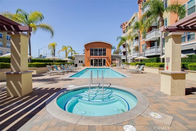12668 Chapman Ave Unit 2403, Garden Grove, CA 92840 - community pool featuring a community hot tub, a patio, and a pergola