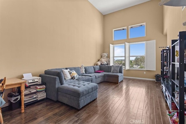 12668 Chapman Ave Unit 2403, Garden Grove, CA 92840 - living room featuring dark wood-type flooring, baseboards, and a high ceiling