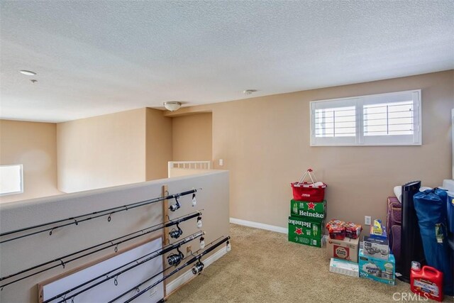 12668 Chapman Ave Unit 2403, Garden Grove, CA 92840 - recreation room featuring a textured ceiling, carpet floors, and baseboards
