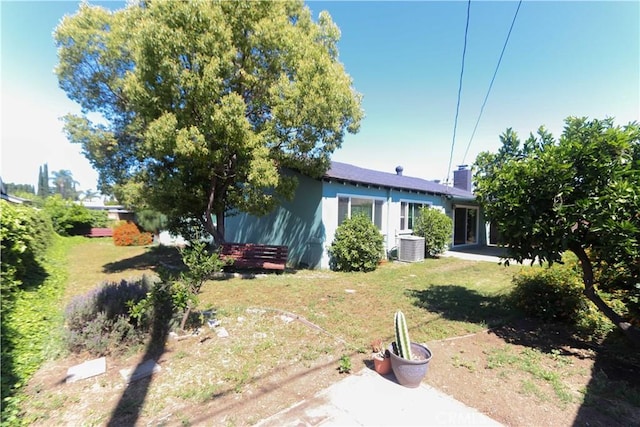 9943 Vernon Ave, Montclair, CA 91763 - view of grassy yard with central air condition unit