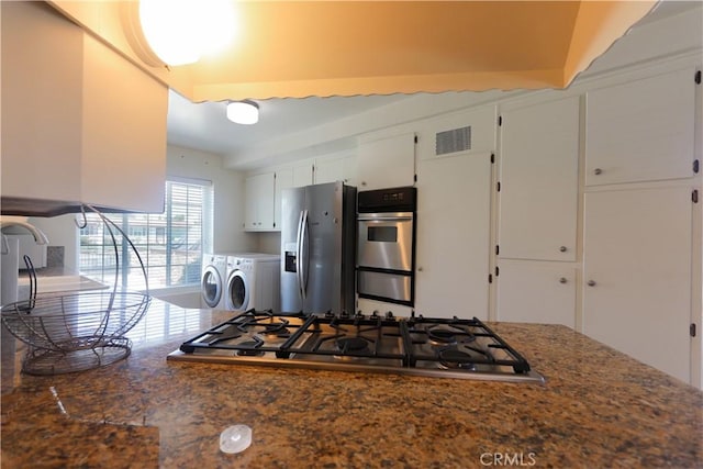 9943 Vernon Ave, Montclair, CA 91763 - kitchen featuring washer and clothes dryer, appliances with stainless steel finishes, and white cabinetry