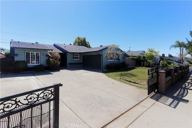 9943 Vernon Ave, Montclair, CA 91763 - single story home with concrete driveway, a gate, and an attached garage