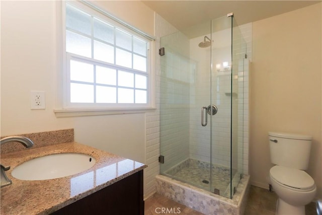 9943 Vernon Ave, Montclair, CA 91763 - full bathroom with a stall shower, toilet, and vanity