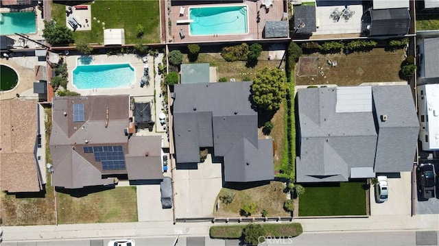 9943 Vernon Ave, Montclair, CA 91763 - aerial view of property and surrounding area featuring a pool area