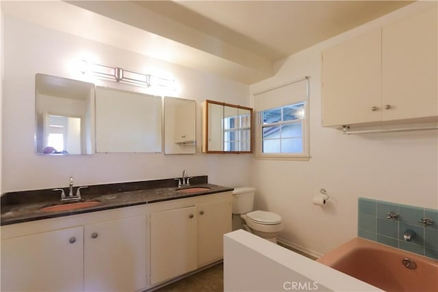 9943 Vernon Ave, Montclair, CA 91763 - bathroom featuring toilet, a garden tub, and double vanity