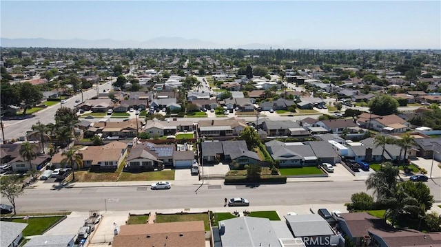 9943 Vernon Ave, Montclair, CA 91763 - aerial perspective of suburban area featuring a mountainous background