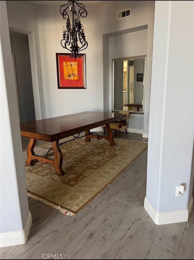 17287 Grove Dr, Riverside, CA 92503 - corridor featuring baseboards, wood finished floors, and a chandelier