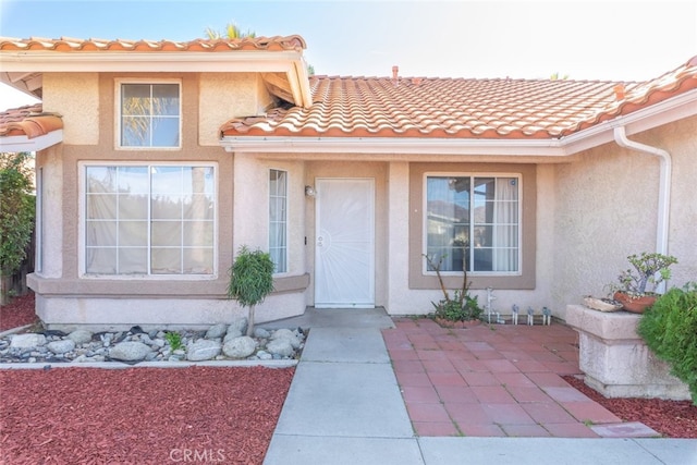 43419 Olive Ave, Hemet, CA 92544 - property entrance with stucco siding and a tile roof