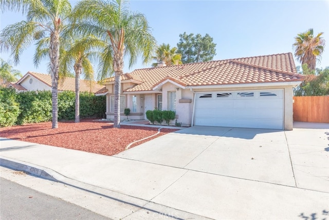 43419 Olive Ave, Hemet, CA 92544 - mediterranean / spanish home with a tiled roof, stucco siding, driveway, and a garage