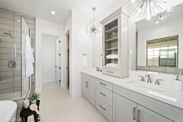 4140 Hillside Dr, San Luis Obispo, CA 93401 - bathroom with a chandelier, a stall shower, double vanity, and a freestanding bath