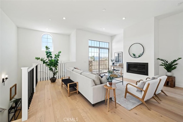 4140 Hillside Dr, San Luis Obispo, CA 93401 - living area featuring light wood-type flooring, a glass covered fireplace, recessed lighting, and baseboards