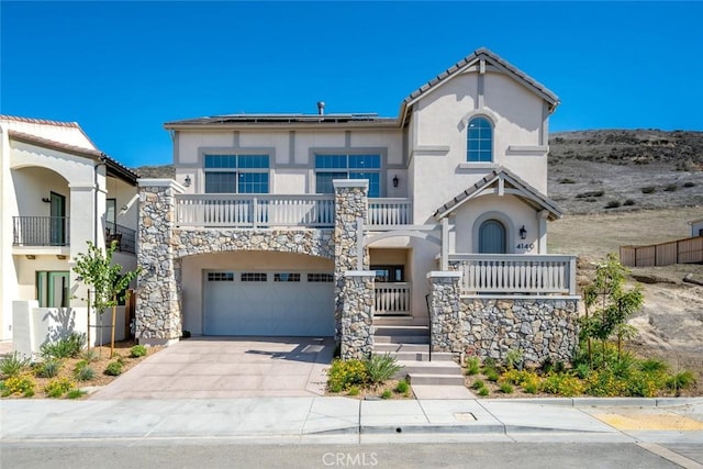 4140 Hillside Dr, San Luis Obispo, CA 93401 - view of front of house with stucco siding, driveway, a garage, and a balcony