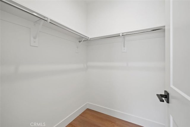 4140 Hillside Dr, San Luis Obispo, CA 93401 - spacious closet featuring wood finished floors