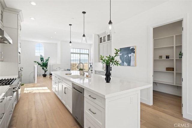 4140 Hillside Dr, San Luis Obispo, CA 93401 - kitchen with a sink, dishwasher, light wood finished floors, light countertops, and recessed lighting