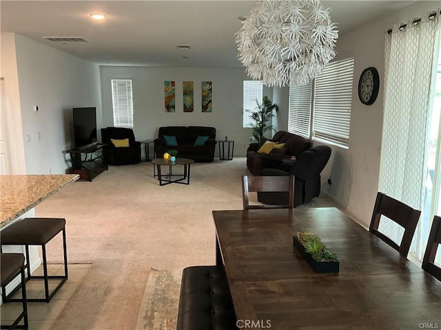 dining area featuring a chandelier