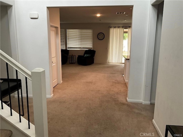 corridor with carpet floors, baseboards, and recessed lighting