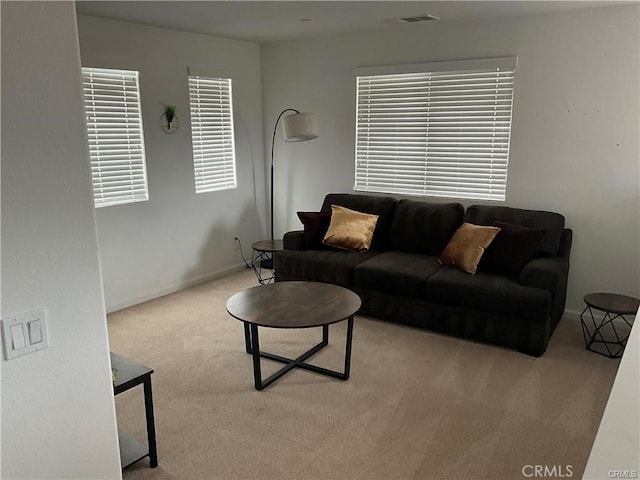 living room with carpet flooring and baseboards