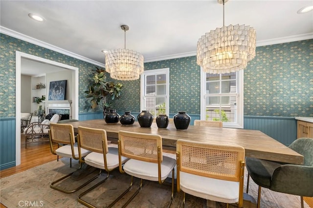 426 Ultimo Ave, Long Beach, CA 90814 - dining area with a chandelier, wood finished floors, wainscoting, wallpapered walls, and crown molding