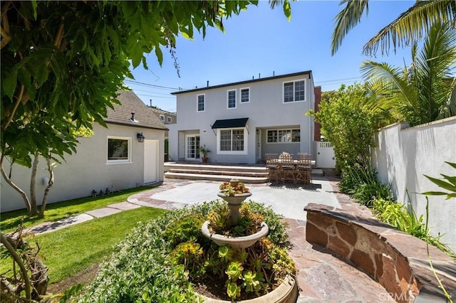 426 Ultimo Ave, Long Beach, CA 90814 - rear view of property with stucco siding and a patio