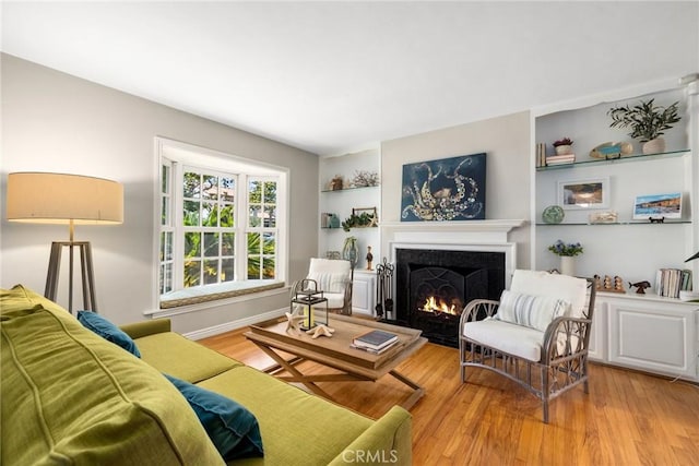426 Ultimo Ave, Long Beach, CA 90814 - living room featuring a fireplace with flush hearth and wood finished floors