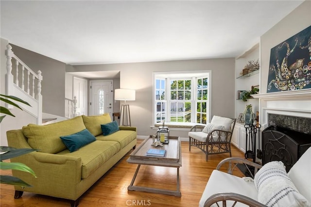 426 Ultimo Ave, Long Beach, CA 90814 - living area featuring stairway, wood finished floors, and a premium fireplace