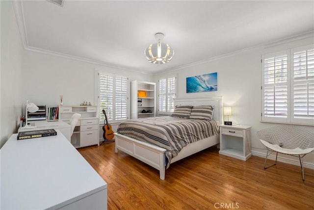 426 Ultimo Ave, Long Beach, CA 90814 - bedroom with a chandelier, multiple windows, ornamental molding, and light wood-style floors