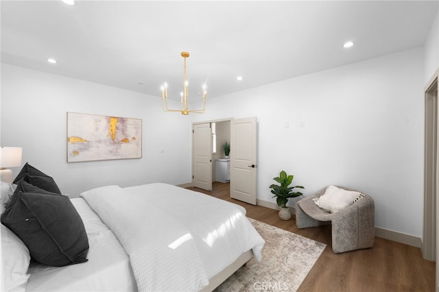 16225 Orizaba Ave, Paramount, CA 90723 - bedroom with a chandelier, wood finished floors, recessed lighting, and baseboards
