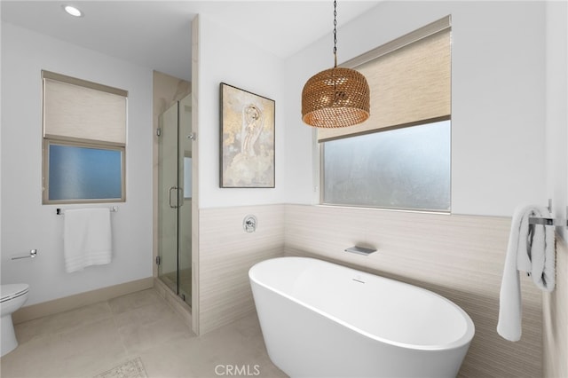 16225 Orizaba Ave, Paramount, CA 90723 - full bath with a stall shower, a freestanding bath, tile patterned floors, toilet, and tile walls