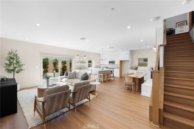 16225 Orizaba Ave, Paramount, CA 90723 - living room with light wood-type flooring, stairs, and recessed lighting
