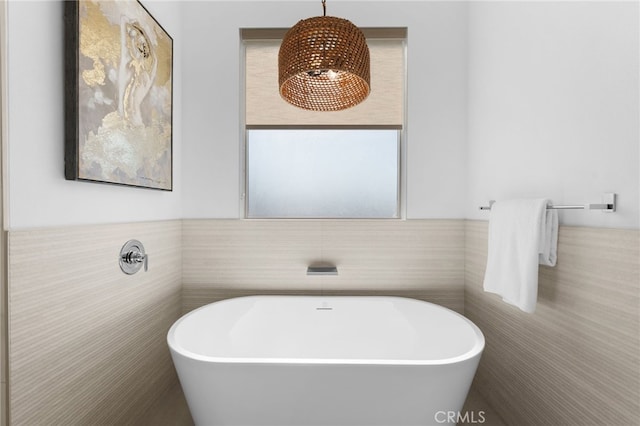 16225 Orizaba Ave, Paramount, CA 90723 - full bathroom featuring tile walls, a freestanding bath, and a wainscoted wall