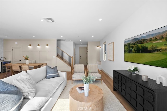 16225 Orizaba Ave, Paramount, CA 90723 - living area with beverage cooler, stairs, wood finished floors, and recessed lighting