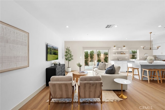 16225 Orizaba Ave, Paramount, CA 90723 - living room with light wood-style flooring, recessed lighting, and baseboards