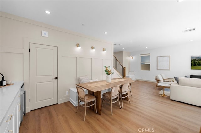 16225 Orizaba Ave, Paramount, CA 90723 - dining room featuring light wood finished floors, stairway, and recessed lighting