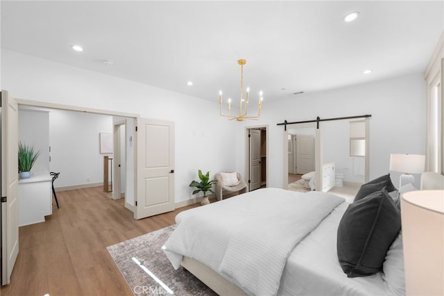 16225 Orizaba Ave, Paramount, CA 90723 - bedroom featuring a chandelier, a barn door, light wood-style floors, recessed lighting, and baseboards