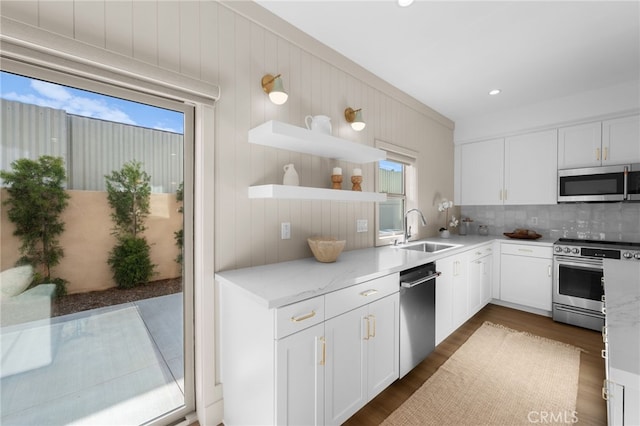 16225 Orizaba Ave, Paramount, CA 90723 - kitchen featuring appliances with stainless steel finishes, a sink, healthy amount of natural light, backsplash, and recessed lighting