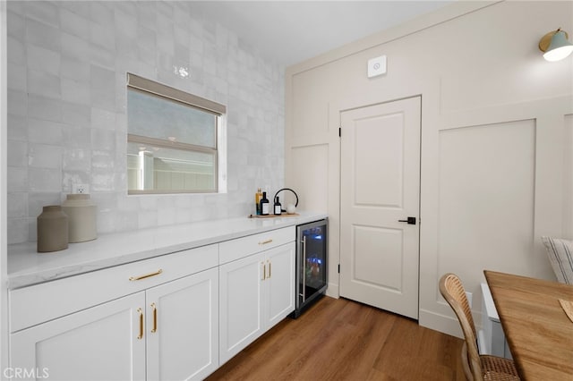 16225 Orizaba Ave, Paramount, CA 90723 - indoor bar featuring wine cooler, tasteful backsplash, and dark wood-style floors