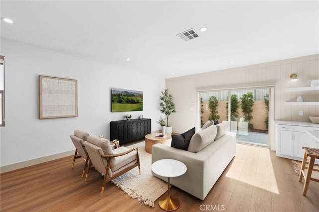 16225 Orizaba Ave, Paramount, CA 90723 - living room with light wood-style floors and recessed lighting