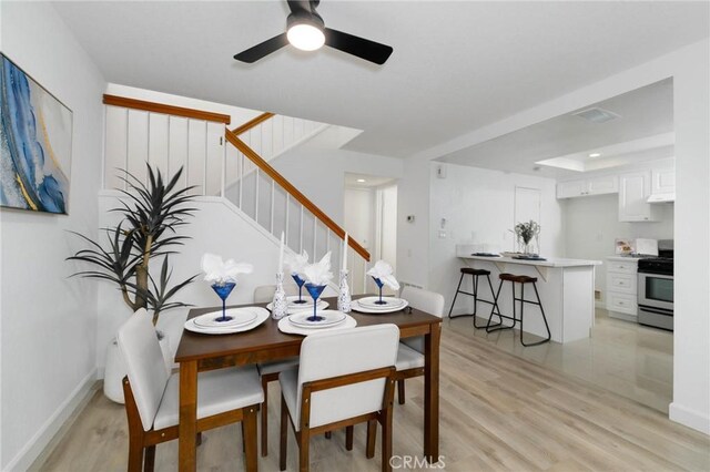 1327 Solera Ln Unit 6, Diamond Bar, CA 91765 - dining room featuring stairs, light wood finished floors, a ceiling fan, and baseboards