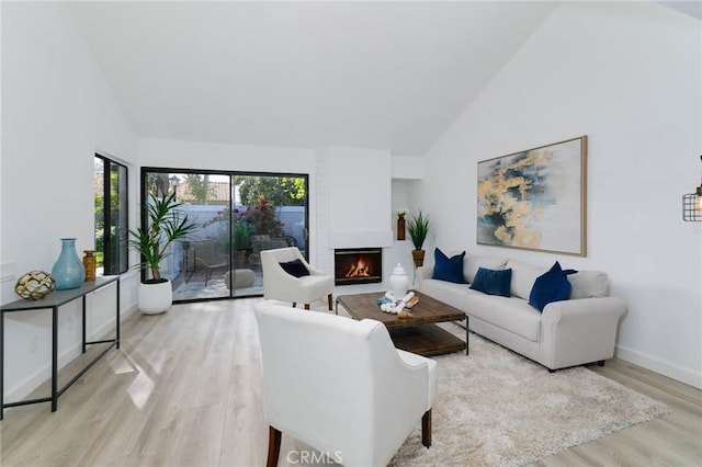 1327 Solera Ln Unit 6, Diamond Bar, CA 91765 - living area featuring wood finished floors, high vaulted ceiling, a fireplace, and baseboards