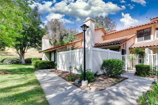 1327 Solera Ln Unit 6, Diamond Bar, CA 91765 - view of front of home featuring a chimney, a tile roof, and stucco siding