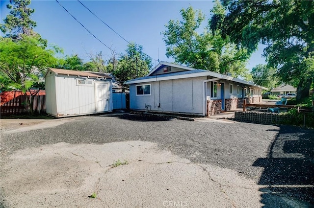 1905 Normal Ave, Chico, CA 95928 - view of front of house featuring fence, a shed, and an outbuilding