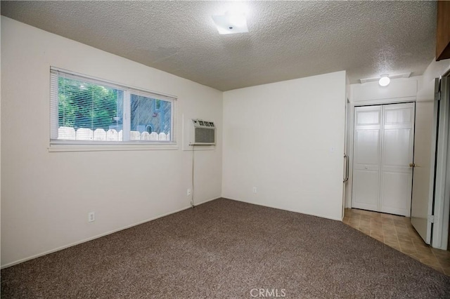 1905 Normal Ave, Chico, CA 95928 - carpeted empty room featuring an AC wall unit and a textured ceiling