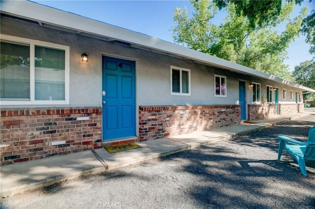 1905 Normal Ave, Chico, CA 95928 - view of exterior entry featuring brick siding and stucco siding