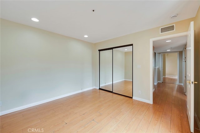 1161 Spazier Ave Unit 4, Glendale, CA 91201 - unfurnished bedroom with light wood-style flooring, a closet, baseboards, and recessed lighting