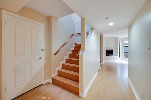 1161 Spazier Ave Unit 4, Glendale, CA 91201 - staircase with wood finished floors, baseboards, recessed lighting, and a fireplace
