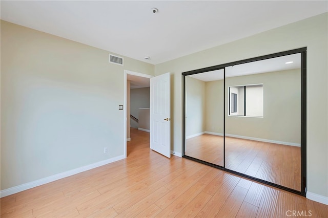 1161 Spazier Ave Unit 4, Glendale, CA 91201 - unfurnished bedroom featuring light wood-style flooring, baseboards, and a closet