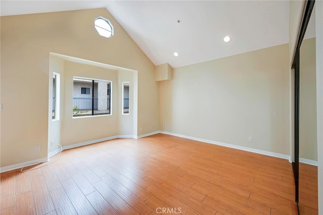 1161 Spazier Ave Unit 4, Glendale, CA 91201 - spare room featuring light wood finished floors, high vaulted ceiling, and baseboards