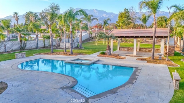 12932 Carnesi Dr, Rancho Cucamonga, CA 91739 - view of pool featuring a mountain view, a patio, and a pool with connected hot tub